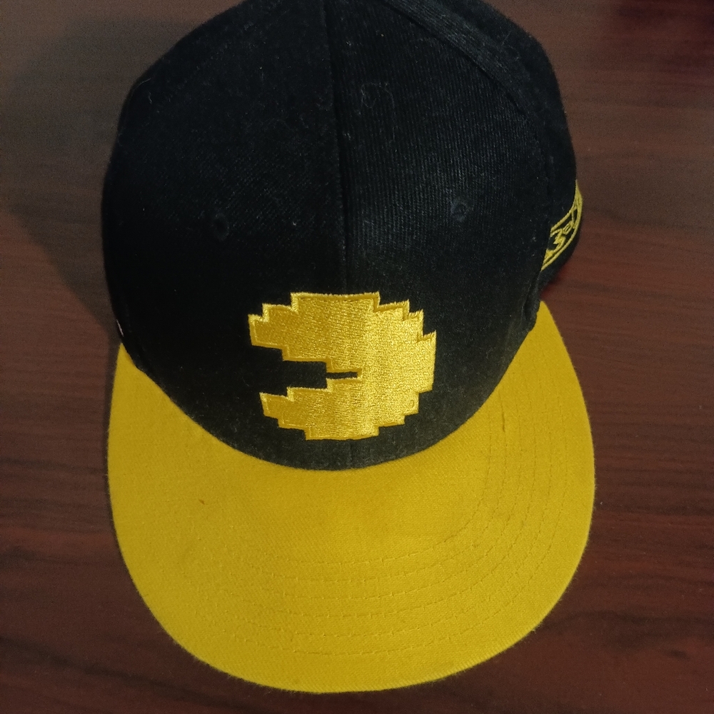 Black and Yellow Cap with Pac Ma Design.